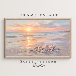 May include: A framed painting of a beach scene at sunset. The artwork features a sandy shore, gentle waves, and a vibrant sky with shades of orange and pink. Seashells are scattered on the sand. The text "FRAME TV ART" and "Screen Season Studio" are visible.
