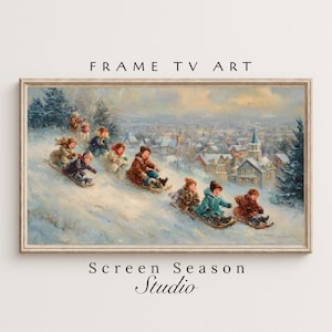 Könnte beinhalten: Eine gerahmte Vintage-Winterszene zeigt Kinder, die einen schneebedeckten Hügel hinunter rodeln. Das Kunstwerk zeigt eine verschneite Landschaft mit einer Stadt im Hintergrund. Der Rahmen trägt oben den Text "FRAME TV ART" und unten "Screen Season Studio".