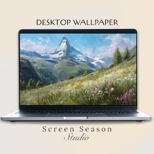 May include: A silver laptop shows a desktop wallpaper of a mountain scene with a snow-covered peak, green slopes, and wildflowers. The text "DESKTOP WALLPAPER" and "Screen Season Studio" are displayed on the screen.