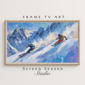 May include: An oil painting of two skiers racing down a snowy mountain slope. The artwork is framed and features a winter landscape with blue, white, and purple hues. The text "FRAME TV ART" and "Screen Season Studio" are visible.