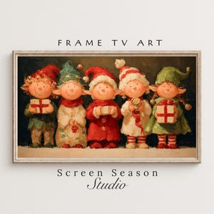 May include: A framed print featuring five whimsical elf figures in festive attire. Each elf holds a gift box, wearing a different colored hat and outfit. The text "FRAME TV ART" and "Screen Season Studio" are visible.
