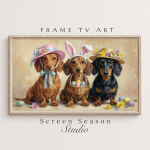 Könnte beinhalten: Gerahmter Kunstdruck mit drei Dackeln in Osterkleidung. Einer trägt einen rosa Hut, ein anderer Hasenohren und der dritte einen Strohhut. Der Druck enthält den Text "FRAME TV ART" und "Screen Season Studio."