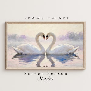 Könnte beinhalten: Gerahmter Kunstdruck mit zwei weißen Schwänen, deren Hälse ein Herz bilden. Das Kunstwerk hat einen weichen, nebligen Hintergrund. Der Text "FRAME TV ART" und "Screen Season Studio" ist zu sehen.
