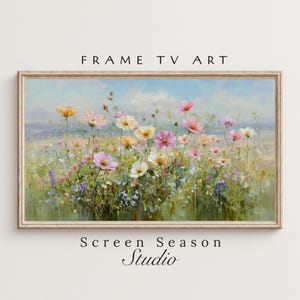 Puede incluir: Una obra de arte enmarcada que representa un campo de flores coloridas sobre un fondo de cielo azul claro. Las flores son en tonos de rosa, amarillo y blanco. El texto "FRAME TV ART" está en la parte superior y "Screen Season Studio" en la parte inferior.