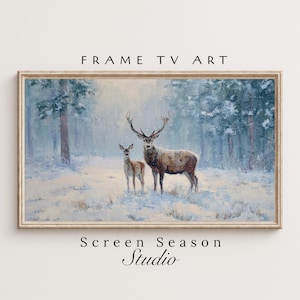 Könnte beinhalten: Gerahmtes Landschaftsgemälde mit einem Hirsch und einem Reh in einem verschneiten Wald. Das Kunstwerk hat eine gedämpfte Farbpalette aus Blau-, Grün- und Brauntönen, mit dem Text "FRAME TV ART" und "Screen Season Studio".