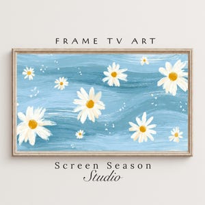 Könnte beinhalten: Gerahmtes digitales Kunstwerk mit hellblauem Hintergrund, verziert mit weißen Gänseblümchen und gelben Zentren. Der Text "FRAME TV ART" und "Screen Season Studio" ist zu sehen.