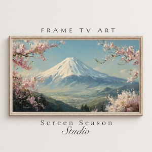 Könnte beinhalten: Gerahmtes Landschaftsgemälde des Fuji mit Kirschblüten. Das Kunstwerk zeigt einen schneebedeckten Berg, einen blauen Himmel und rosa Kirschblüten. Der Text "FRAME TV ART" und "Screen Season Studio" sind sichtbar.