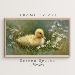 Könnte beinhalten: Gerahmter digitaler Kunstdruck mit einem gelben Entenküken, das sich in hohem grünen Gras und weißen Wildblumen befindet. Das Kunstwerk hat einen weichen, malerischen Stil. Der Text "FRAME TV ART" und "Screen Season Studio" sind sichtbar.