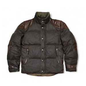 May include: A brown and green quilted puffer jacket with leather accents on the shoulders and sleeves.