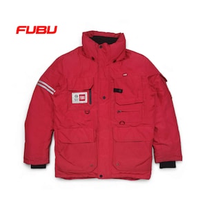 May include: Red winter jacket with a black zipper and multiple pockets. The jacket has a white stripe on each sleeve and a Fubu logo patch on the left chest.