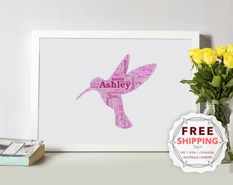 May include: A pink hummingbird word art print with the name "Ashley" in the center. The hummingbird is made up of words describing a person, such as "daughter", "sister", "caring", and "intelligent".