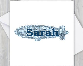 May include: A white card featuring a blue word cloud shaped like a key. The word cloud includes the name "Sarah" and words such as "love", "friends", "memories", "celebration", "achievement", "design", "colourful", and "personalised".