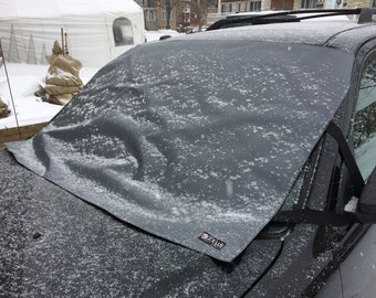 Cubierta para parabrisas fabricada en vinilo resistente, ideal para nieve o hielo.
