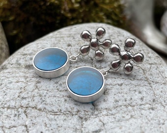 Silver statement ear studs, transparent blue acrylic glass, flower motif earrings