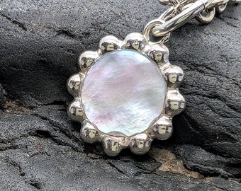 Mother of pearl silver pendant, with decorative frame, minimalist