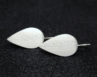 Statement silver ear hooks, floral earrings, minimalistic, light, pendulum teardrop shape