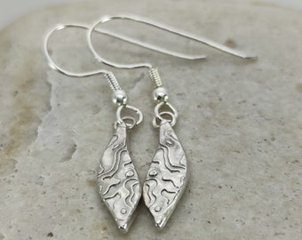 Statement silver ear hooks, imaginative nature motif, Black Forest design