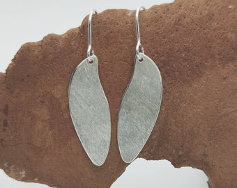 Statement silver ear hooks, petal earrings, minimalist light, Black Forest motif