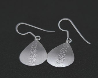 Statement silver ear hooks, floral earrings, minimalist teardrop shape