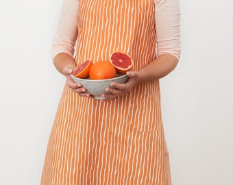 Orange stripy apron, with matching pocket and loop for hanging, Striped apron with height adjustable strap, fits all sizes