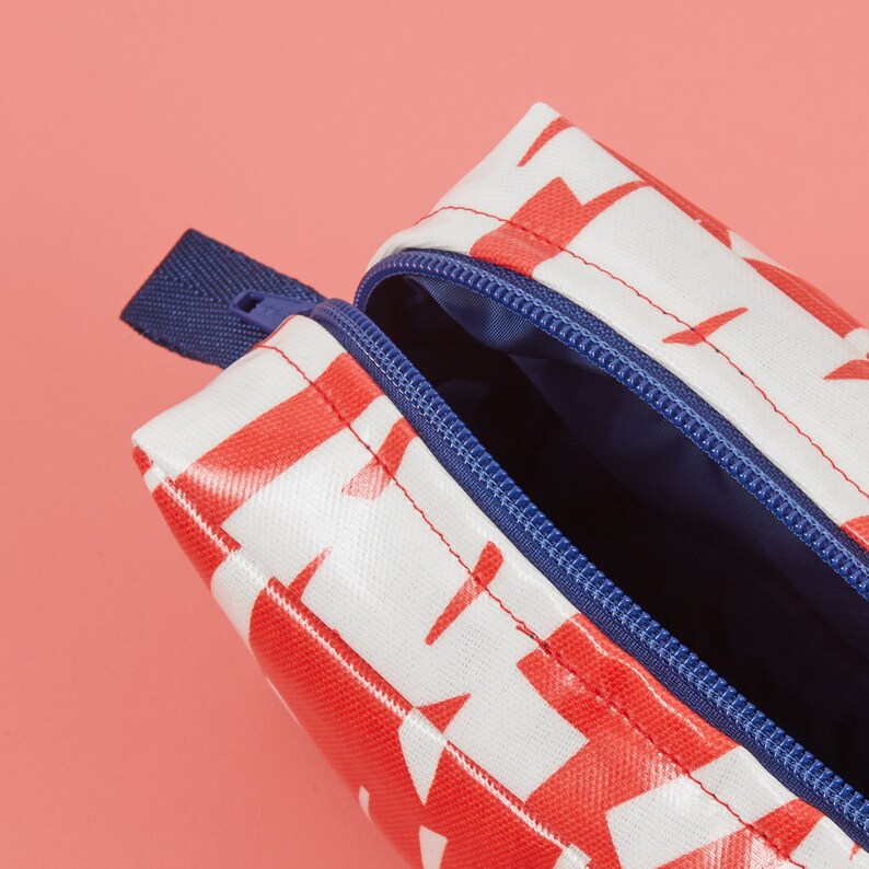 Red and white boxy wash bag with contrasting navy blue waterproof lining and YKK zip, Laminated red and white wash bag with lining image 3