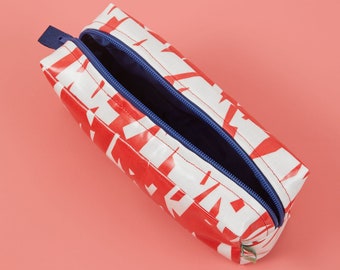 Red and white boxy wash bag with contrasting navy blue waterproof lining and YKK zip, Laminated red and white wash bag with lining