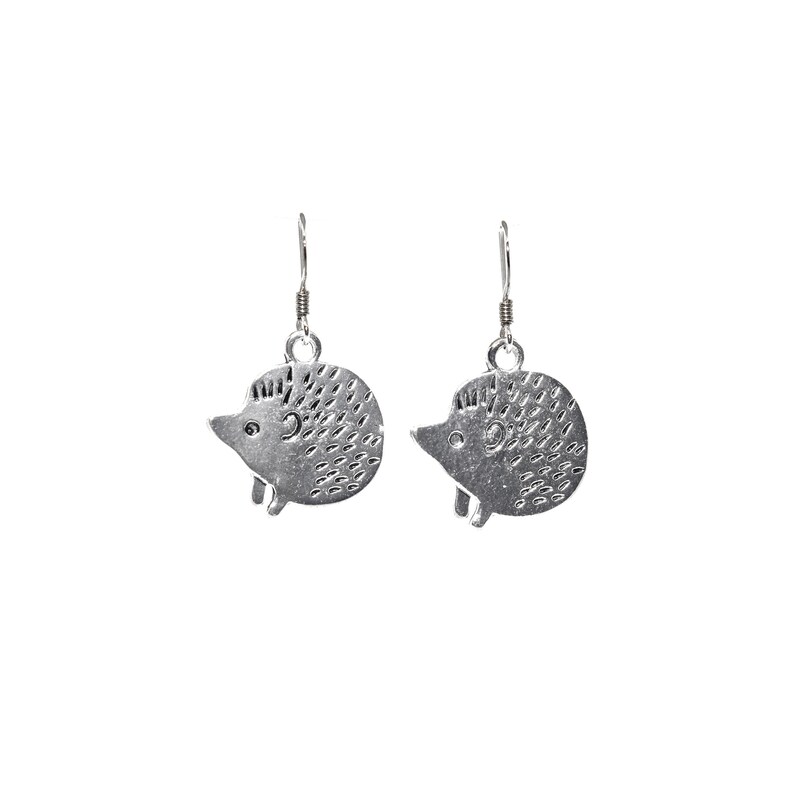 May include: A pair of silver dangle earrings featuring a hedgehog design. The hedgehogs are detailed with small dots and have a slightly raised eye.