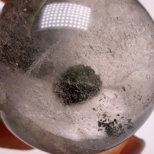 Clear Quartz Phantom Quartz Sphere: Natural Enhydro Crystal with Moving Water