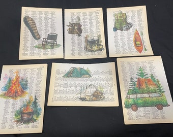 May include: A collection of six art prints featuring camping and outdoor themes. Each print is on a page from a vintage dictionary. The illustrations include a boot, camping chair, campfire, tent, backpack, kayak, and a camper van.