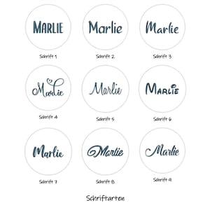 May include: A grid of nine circular icons, each displaying the name Marlie in a different dark blue font style. Below each circle, the text is labeled from Schrift 1 to Schrift 9, with the word Schriftarten centered at the bottom of the image.