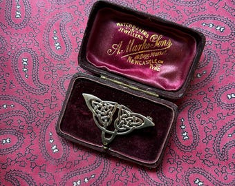 Vintage silver brooch in a Celtic design.
