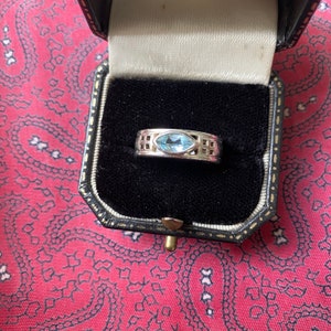 Vintage 1990s silver ring with blue topaz in the style of Rennie Mackintosh. Size P. Weight 6.35g.