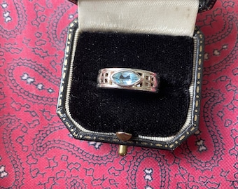 Vintage 1990s silver ring with blue topaz in the style of Rennie Mackintosh. Size P. Weight 6.35g.
