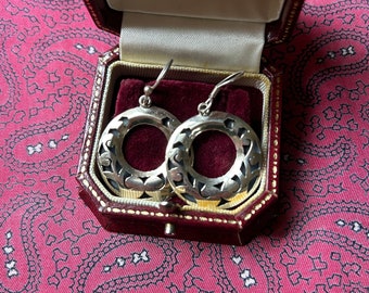 Lovely pair of vintage silver earrings in a modernist circular design.