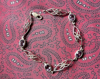 Exquisite little vintage silver and amethyst link bracelet in a Celtic design.