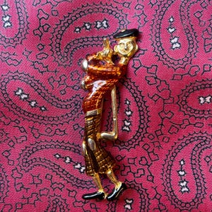Vintage gold tone gentleman golfer brooch.