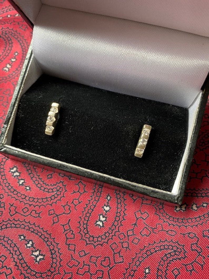 Stunning pair of vintage silver and cubic zirconia stud earrings. image 1