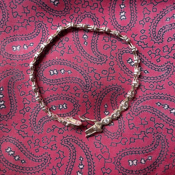 Vintage sterling silver and cubic zirconia tennis bracelet. Weight 8.90g.