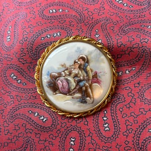 Vintage Limoges brooch in a traditional courting couple design by Bjoux Jackémo.