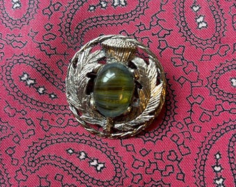 Vintage silver tone and faux banded agate Celtic thistle brooch.
