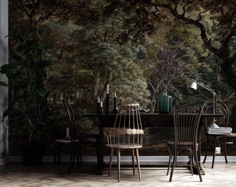 May include: A dark wooden dining table with four chairs, including one with a geometric back, set against a wall mural depicting a dense, moody forest landscape. A green glass vase, candles, and a desk lamp sit on the table surface.