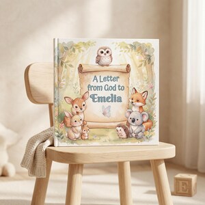 May include: A square hardcover book with a light-colored cover featuring a central scroll with the text A Letter from God to Emelia. The illustration includes a small owl, a deer, a rabbit, a fox, a koala, a hedgehog, and a butterfly.