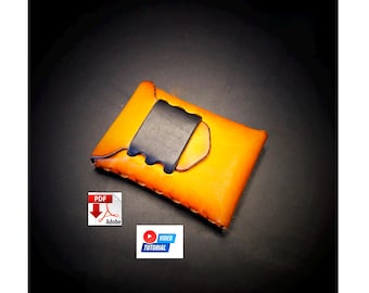 May include: Handmade orange leather card holder with a black leather flap. The card holder has a stitched border and a dark blue accent. The image also includes a PDF and video tutorial icon.