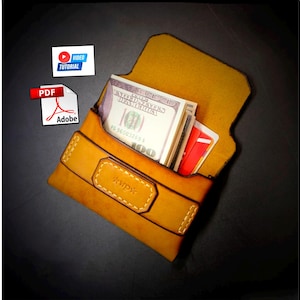 May include: A handcrafted, open leather wallet in a warm tan color, filled with US currency and red cards. The wallet features a stitched design and a rectangular accent with the initials "wp". A video tutorial and PDF Adobe icon are in the background.