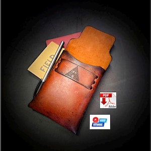 May include: A handcrafted leather pen holder in shades of brown, with a geometric design. A silver pen and a small notepad with the word "FIELD" are visible. The holder has a pocket for the notepad. Includes PDF and video tutorial icons.