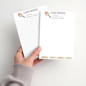 May include: Two white paper notepads titled CASE NOTES with a magnifying glass icon. One pad has horizontal lines, the other has blank space and four bottom tabs labeled SUSPECTS, EVIDENCE, CLUES, and THEORIES. Both include CASE NO. and STEPHANIE CONNERS.