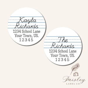 May include: Two white round labels with blue lined paper design. One label reads "Kayla Richards" with an address. The other label reads "The Richards" with an address. The Paisley Label Co. logo is at the bottom.