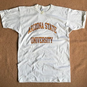 May include: White t-shirt with the text "Arizona State University" in orange lettering.