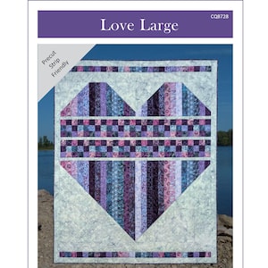 May include: A quilt pattern titled "Love Large" featuring a large heart design. The heart is composed of vertical strips in shades of purple, blue, and pink. The quilt measures 56.5 x 69.5 inches. The pattern is from Canuck Quilter Designs.