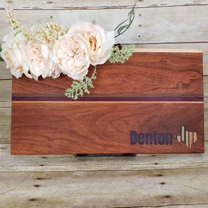 Custom cutting board with a recycled skateboard inlay and food safe epoxy